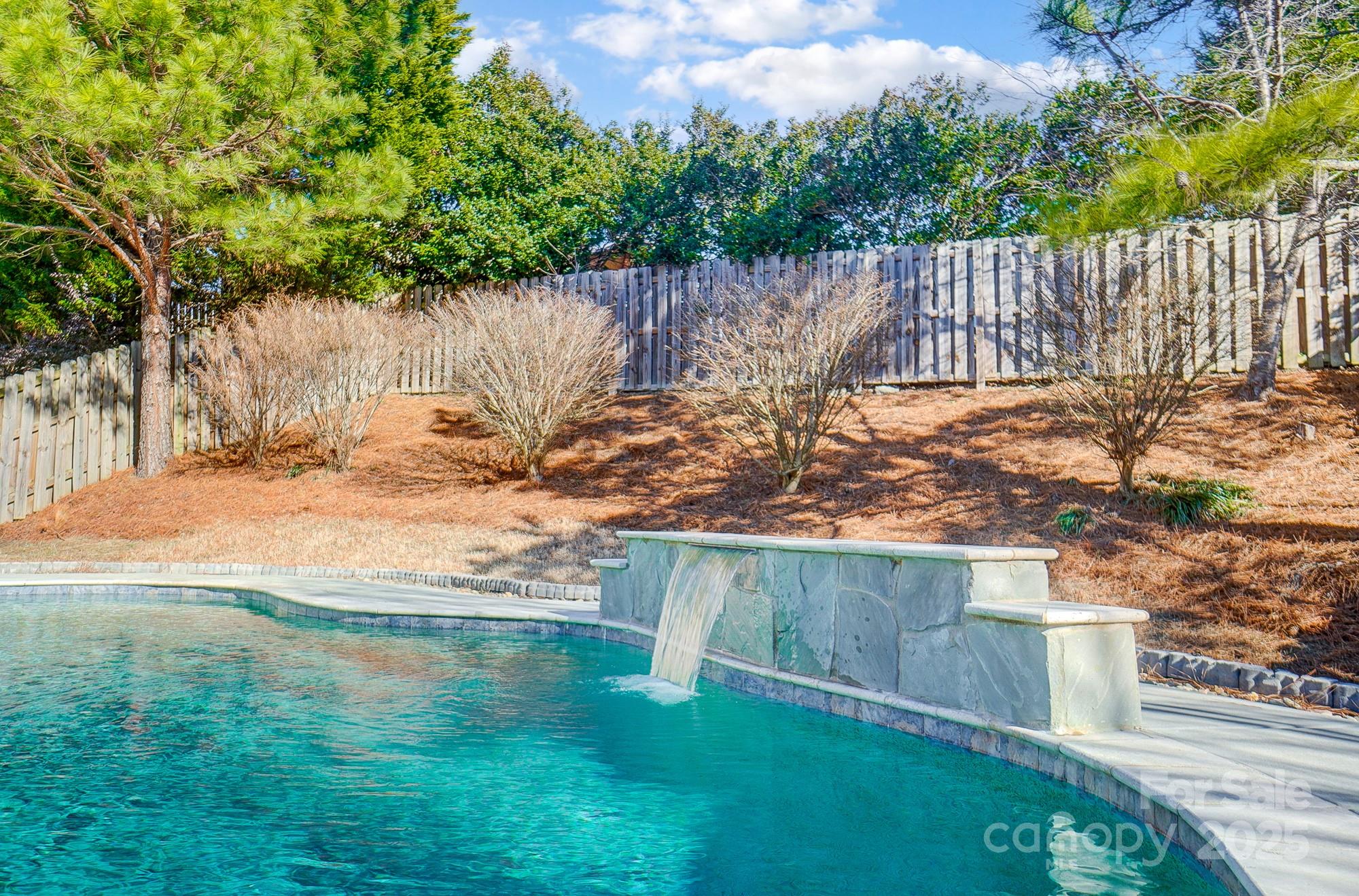 7647 Black Hawk Lane Tega Cay, SC 29708 - Photo 35 of 42 a view of a backyard with wooden fence