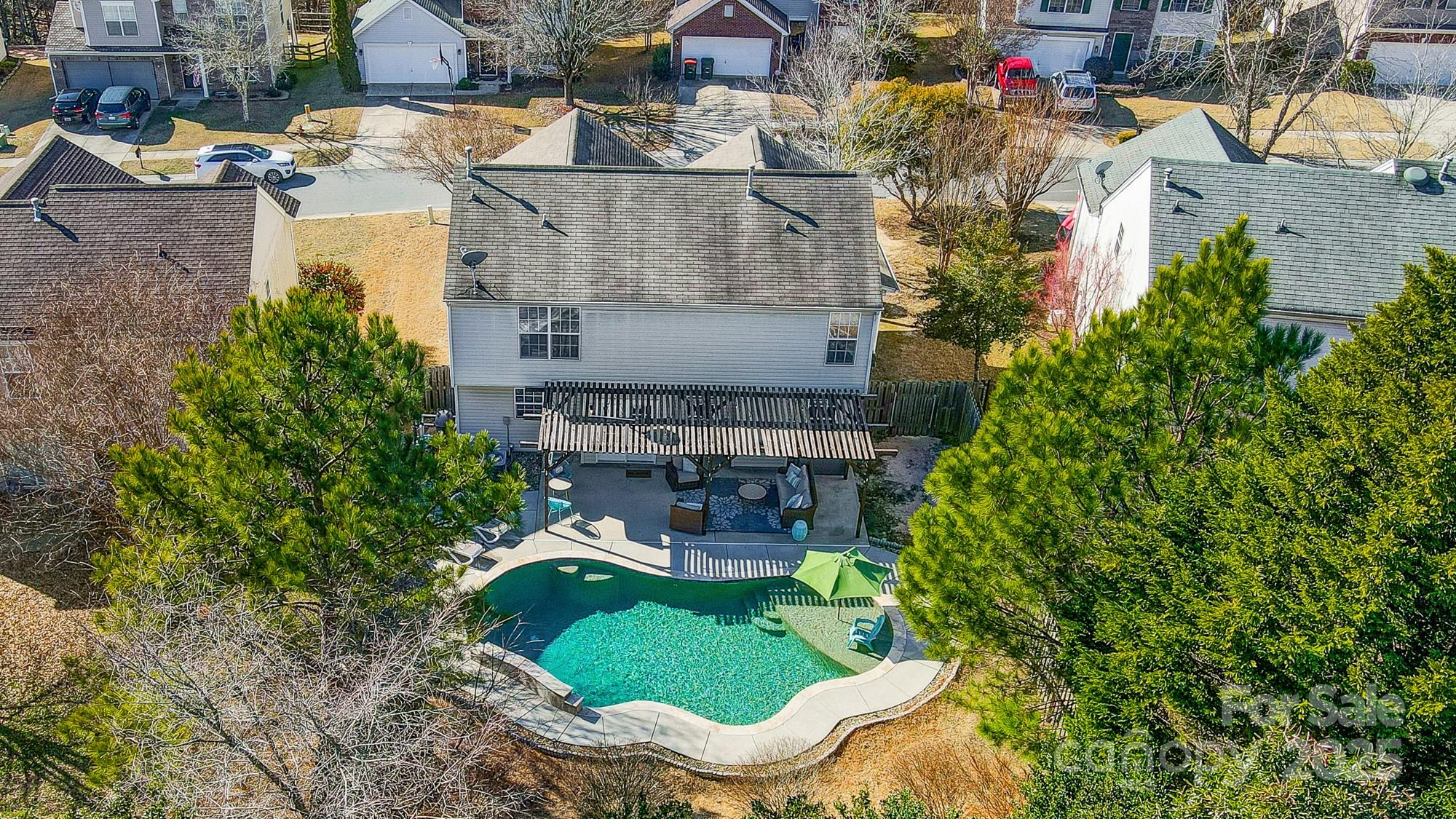 7647 Black Hawk Lane Tega Cay, SC 29708 - Photo 38 of 42 an aerial view of a house with outdoor space pool patio and outdoor seating
