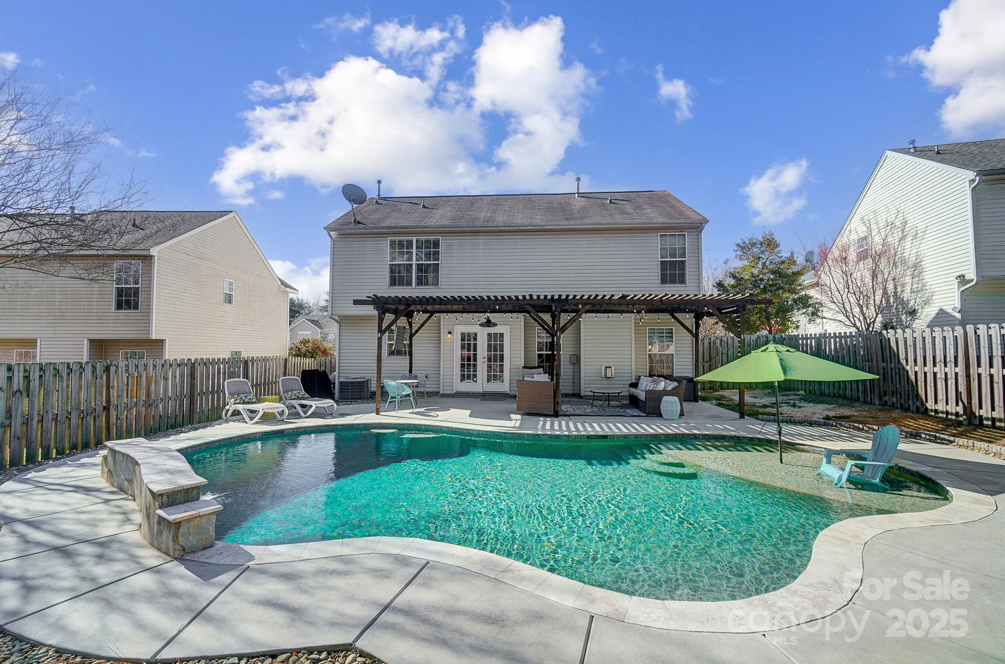 7647 Black Hawk Lane Tega Cay, SC 29708 - Photo 4 of 42 a view of a house with backyard porch and sitting area