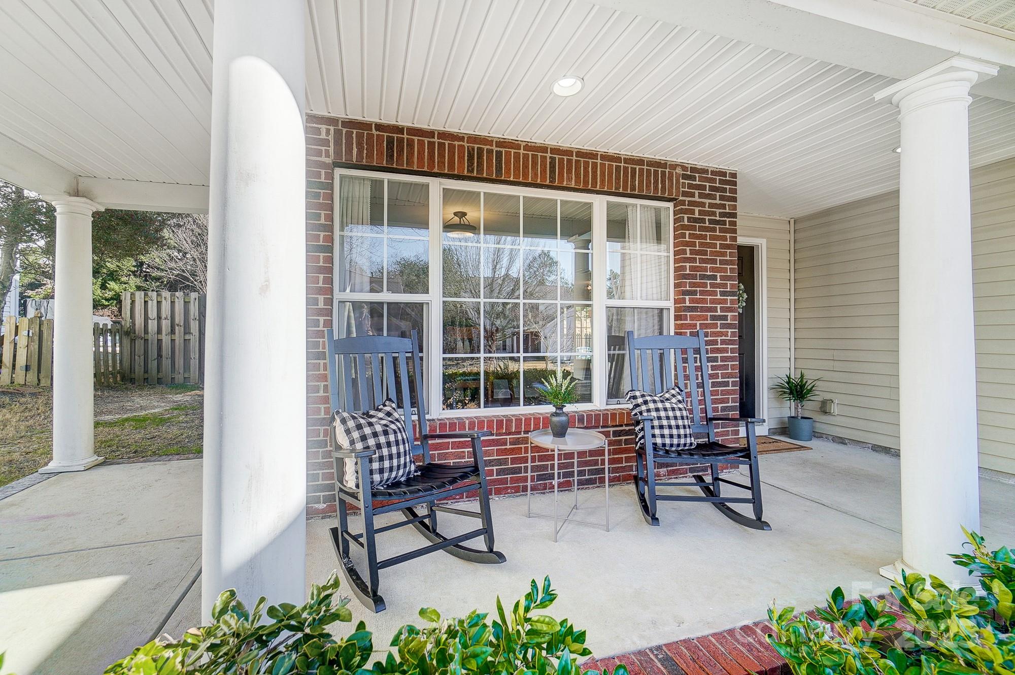 7647 Black Hawk Lane Tega Cay, SC 29708 - Photo 7 of 42 a outdoor living space with furniture and a garden