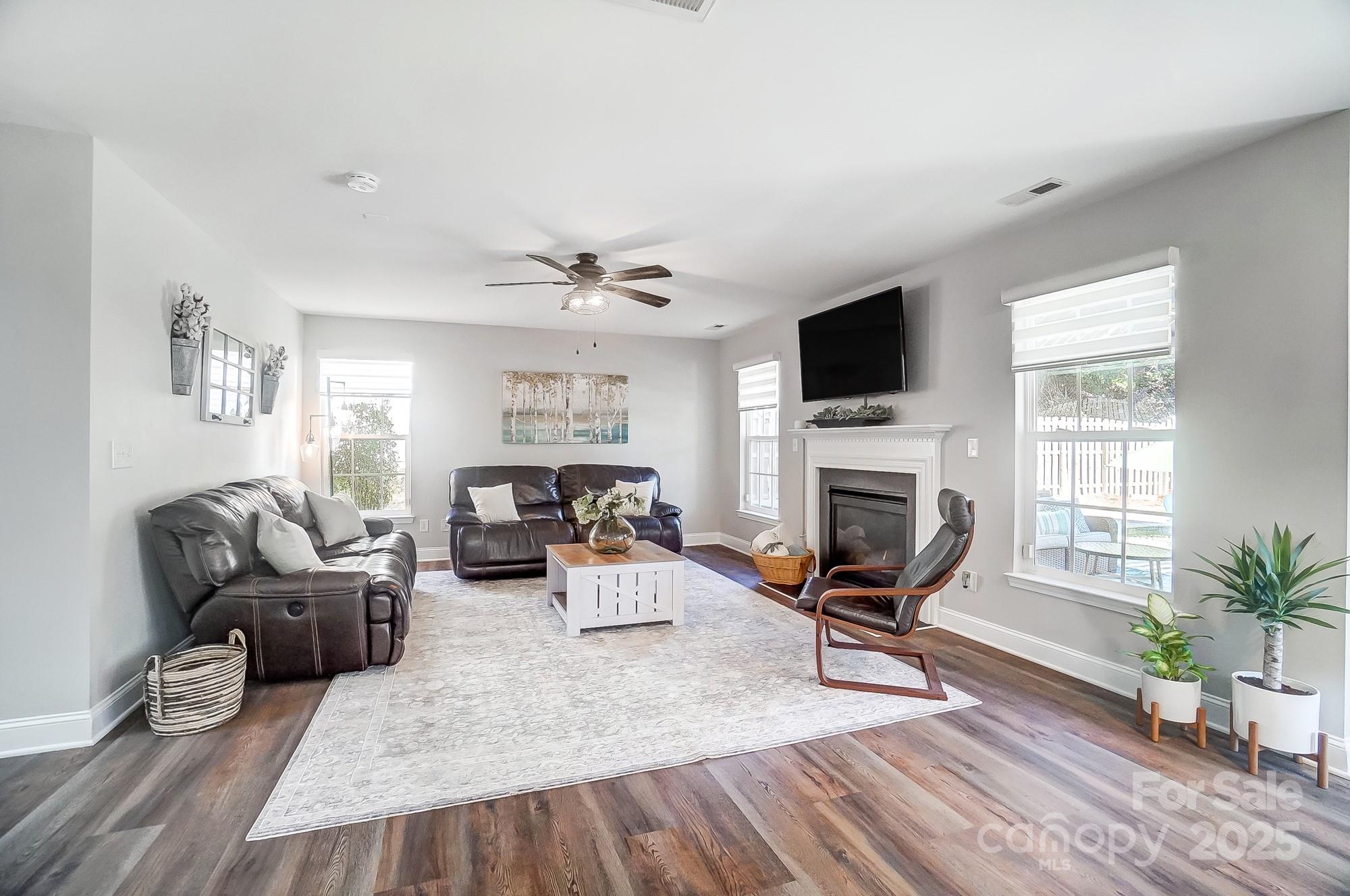 7647 Black Hawk Lane Tega Cay, SC 29708 - Photo 8 of 42 a living room with furniture or fireplace and a flat screen tv