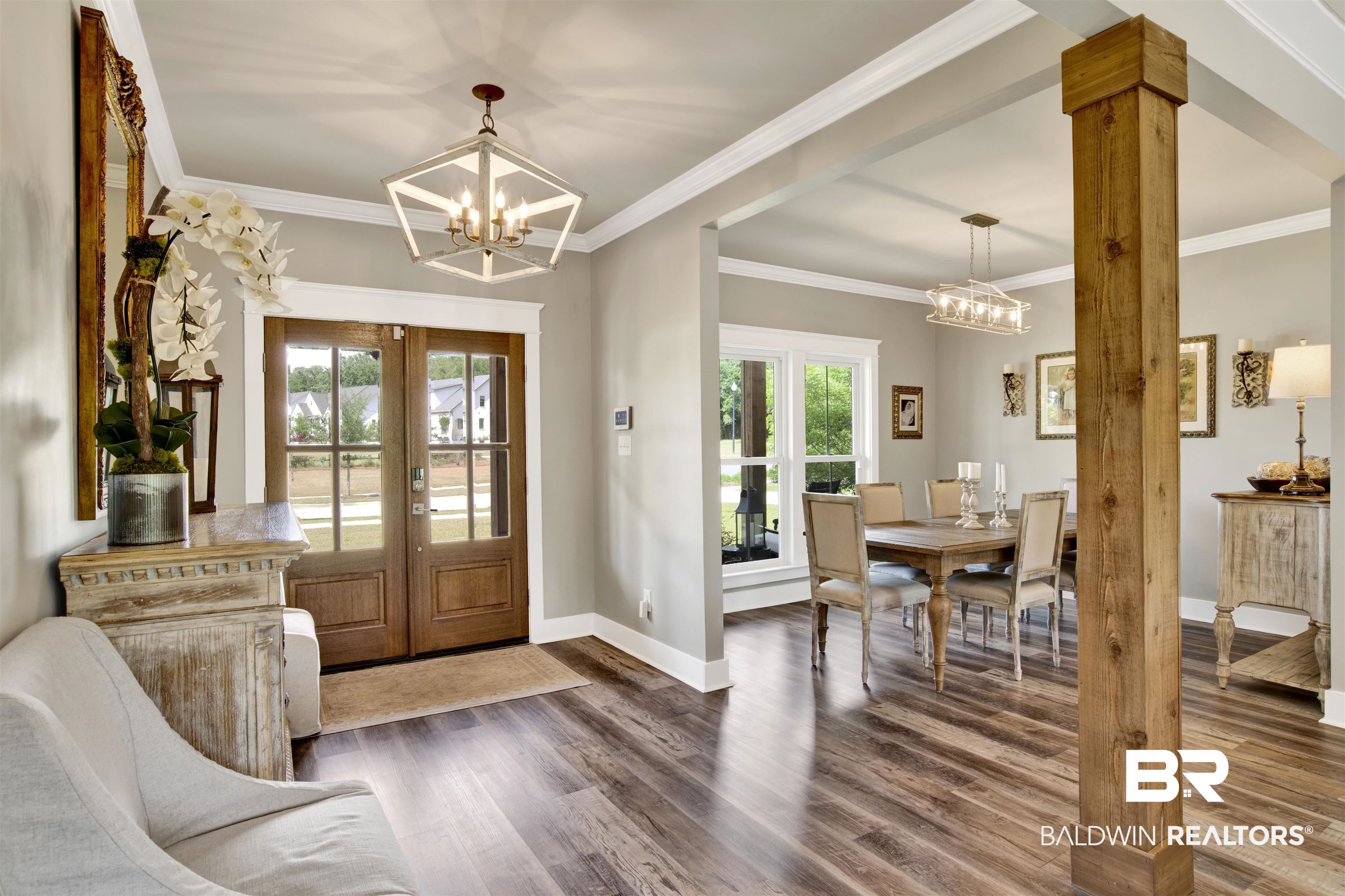 21621 Veranda Boulevard Fairhope, AL 36532 - Photo 37 of 51 Entryway featuring french doors, baseboards, and a notable chandelier