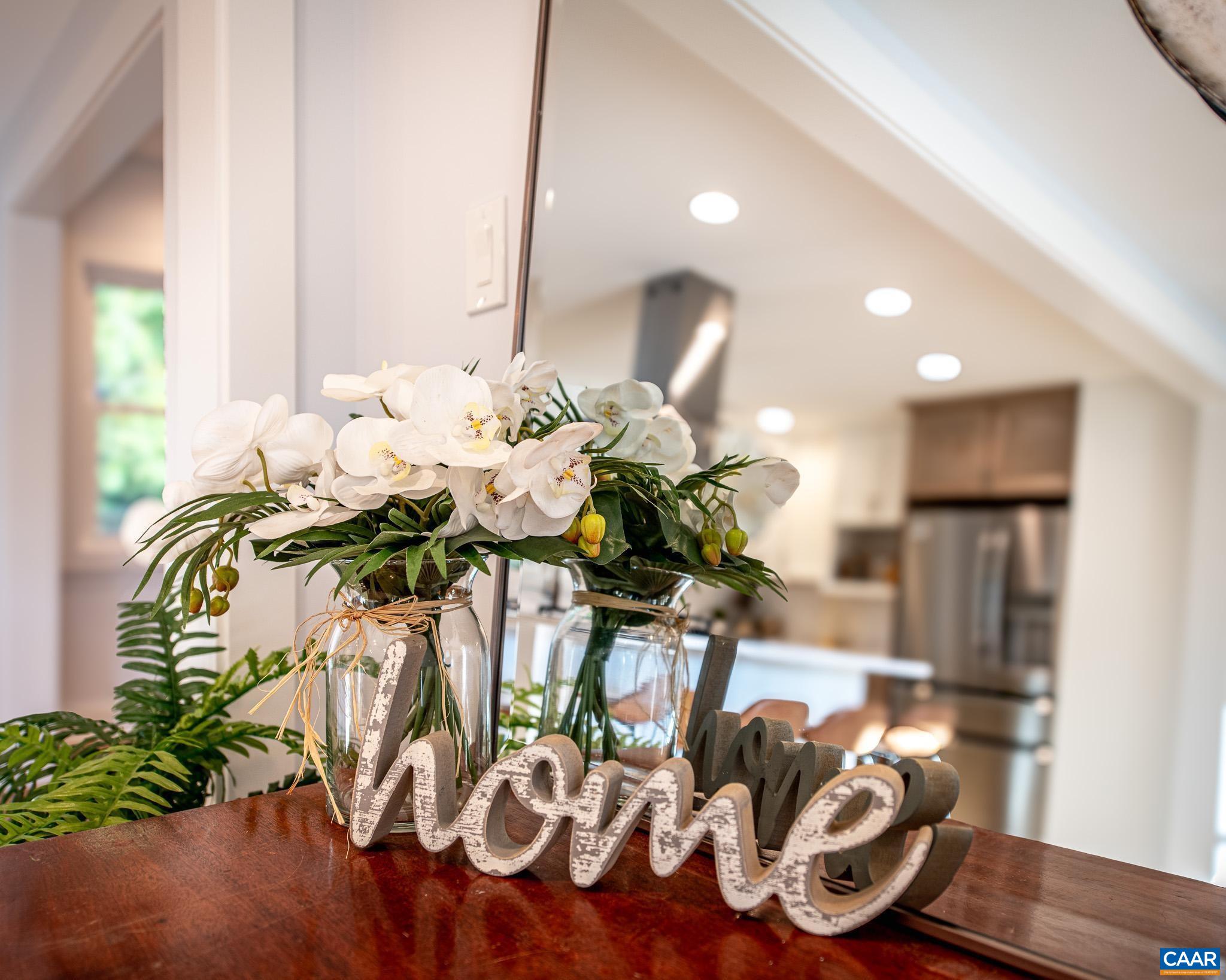 a vase of flowers sitting on a table
