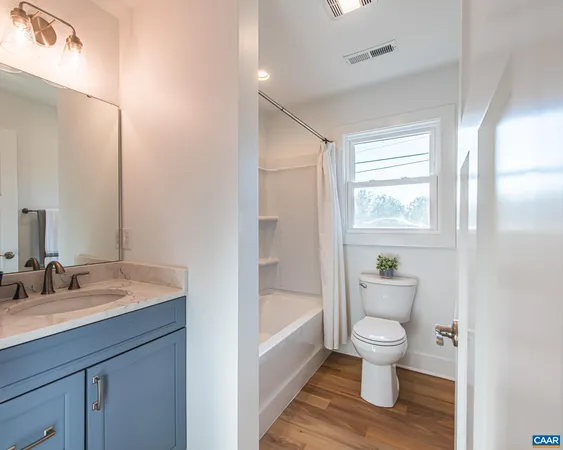a bathroom with a toilet sink and bathtub