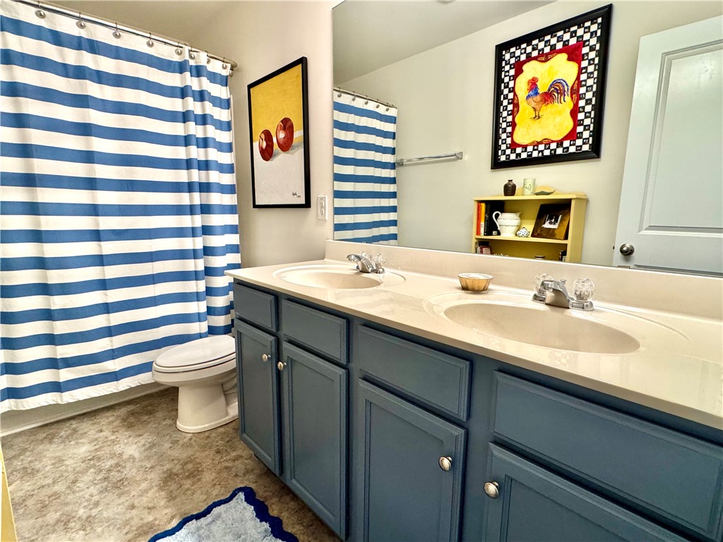 7 Ravencrest Drive Anderson, SC 29621 - Photo 33 of 43 This bathroom features a double vanity with ample storage and a contemporary design.