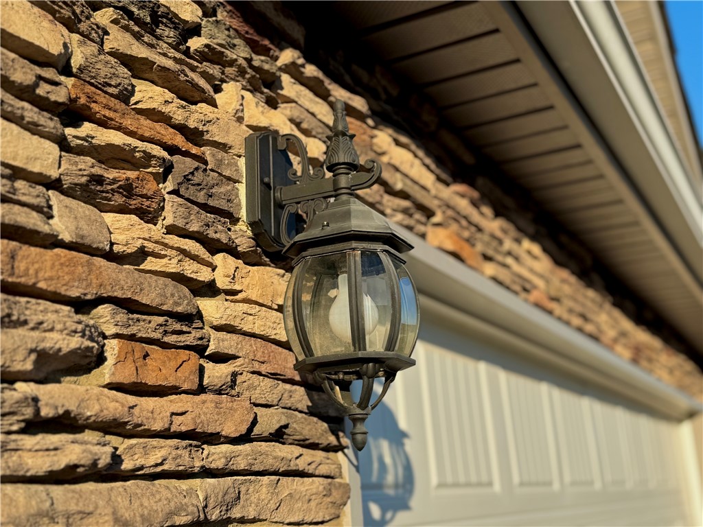 7 Ravencrest Drive Anderson, SC 29621 - Photo 7 of 43 Textured stone facade complements exterior lighting for a welcoming entry.