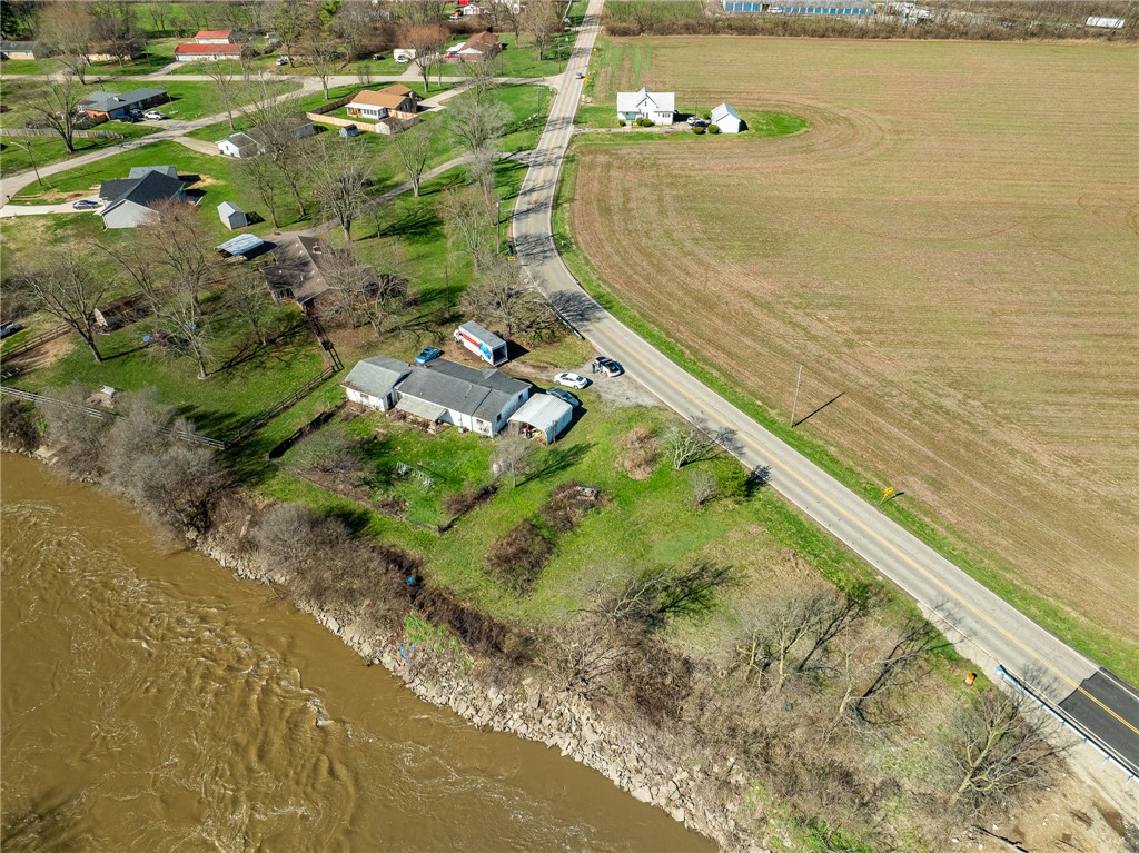 7315 Franklin-Trenton Road Franklin, OH 45005 - Photo 15 of 15 This captivating aerial view captures a vibrant riverfront property, offering a tranquil escape.