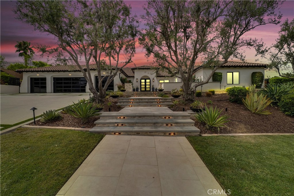 4028 Shady Ridge Drive Corona, CA 92881 - Photo 1 of 1 a front view of a house with a garden