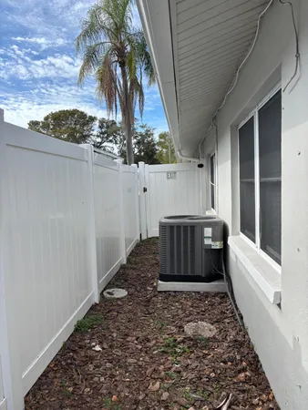 a view of a porch with furniture and a yard