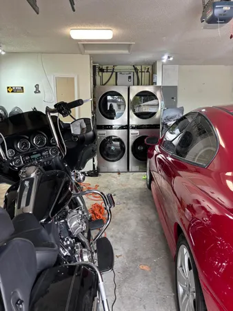 a living room with lots of furniture and windows