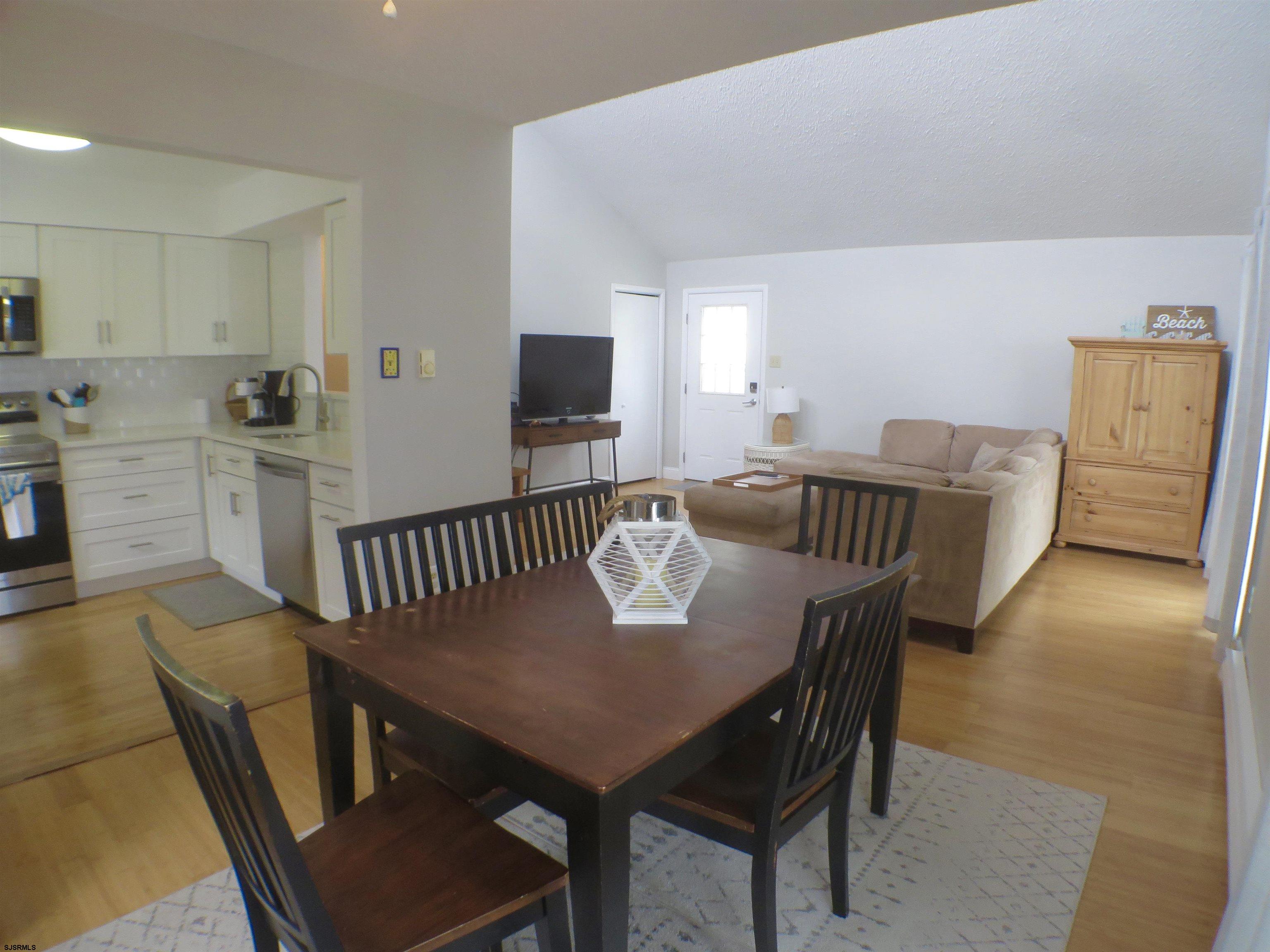 210 Simpson Avenue, Unit 2 Ocean City, NJ 08226 - Photo 6 of 20 a view of a dining room with furniture