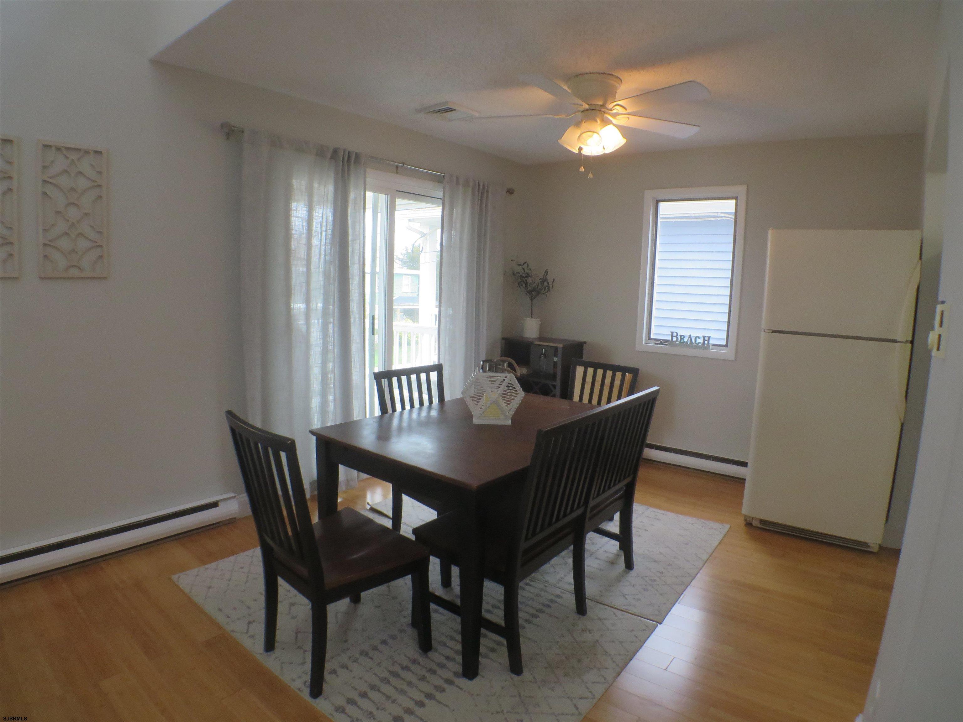 210 Simpson Avenue, Unit 2 Ocean City, NJ 08226 - Photo 7 of 20 a dining room with furniture and window