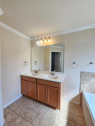 a view of a house with wooden fence