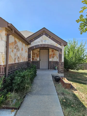 a view of a kitchen with a sink and a living room