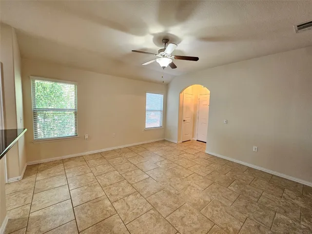 a kitchen with stainless steel appliances granite countertop a stove top oven a sink a counter space and cabinets