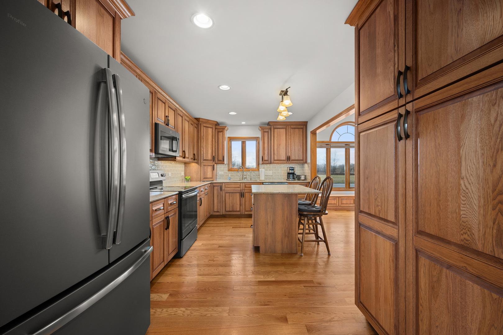 1012 Joshua Lane Genoa, IL 60135 - Photo 19 of 36 a kitchen with a refrigerator and a sink
