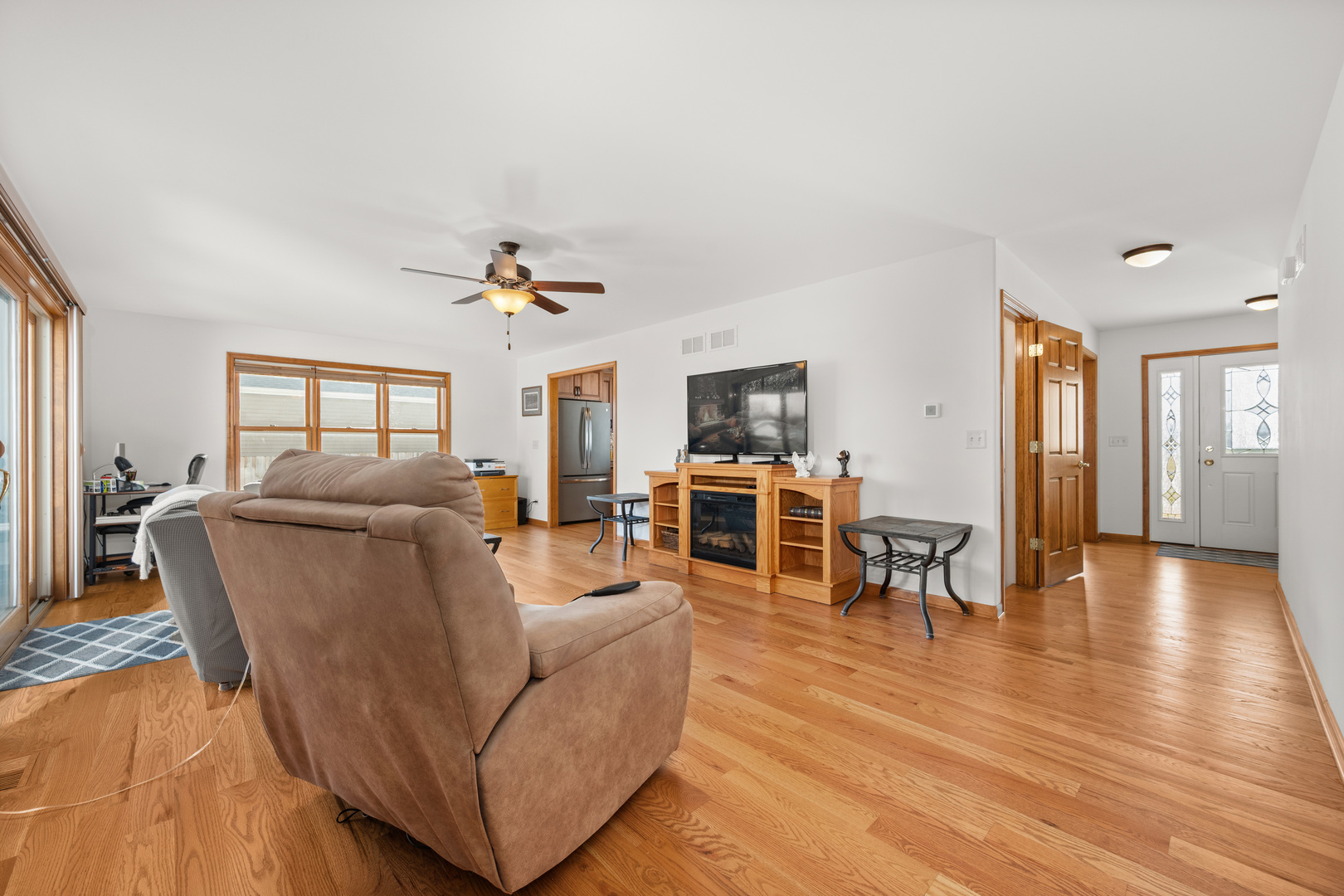 1012 Joshua Lane Genoa, IL 60135 - Photo 21 of 36 a living room with furniture and a wooden floor