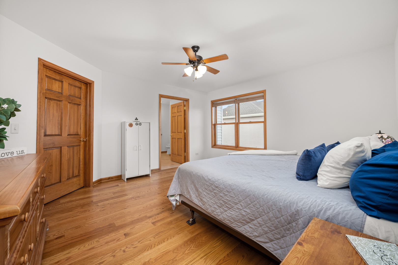 1012 Joshua Lane Genoa, IL 60135 - Photo 25 of 36 a bedroom with a bed and wooden floor