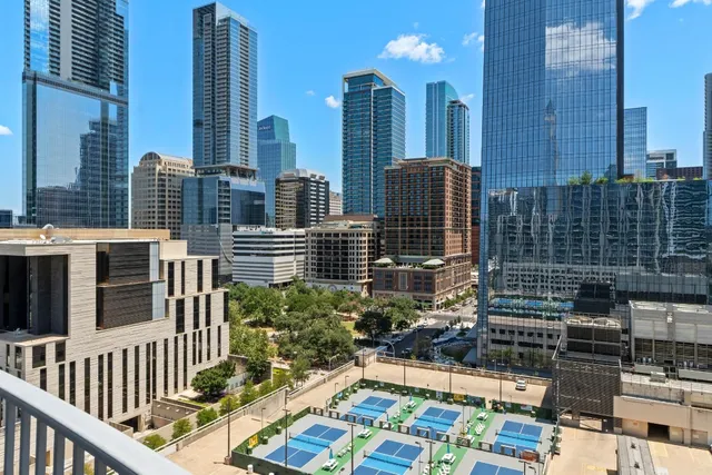 a view of city with tall buildings