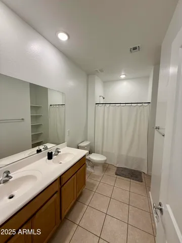 a bathroom with a sink a mirror and a shower