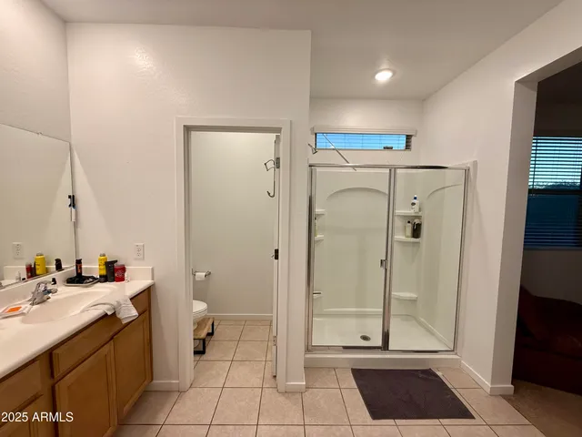 a bathroom with a double vanity sink and mirror