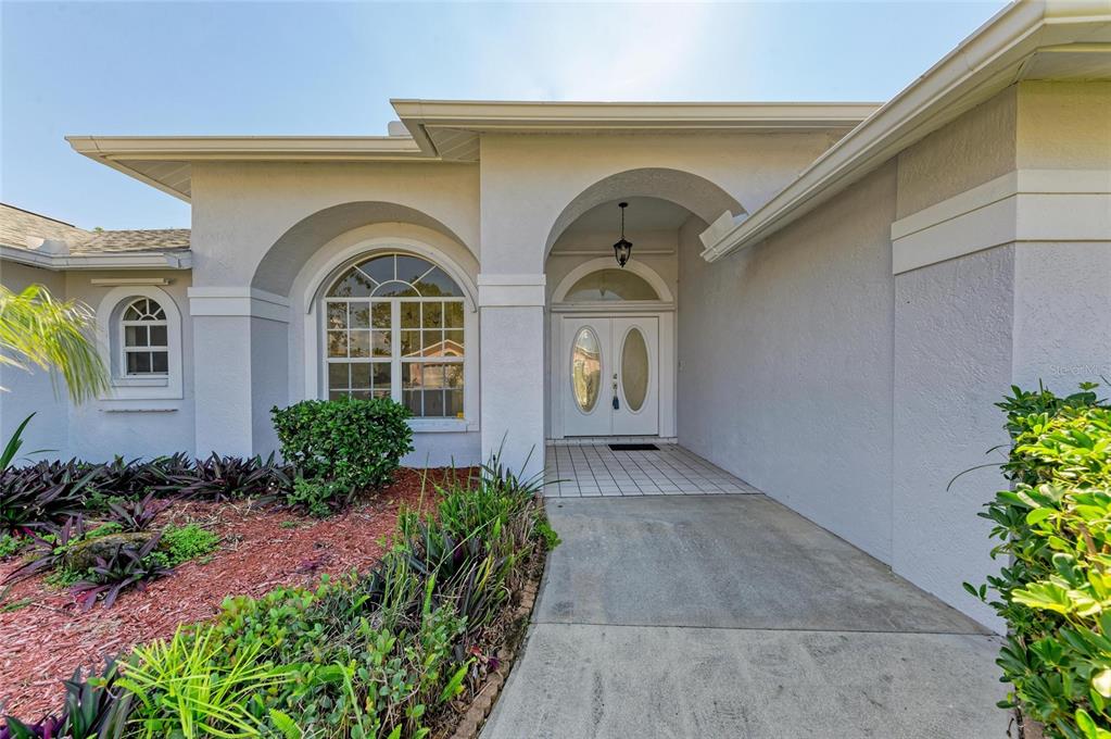 357 Woodvale Drive Venice, FL 34293 - Photo 1 of 1 a front view of a house with garden
