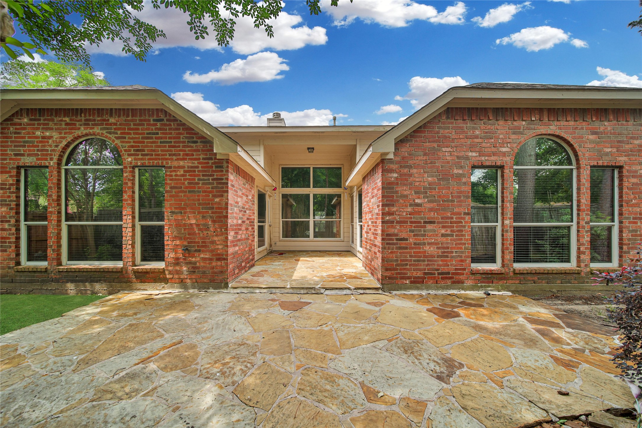 14526 Red Tailed Hawk Lane Houston, TX 77044 - Photo 3 of 40 a view of a brick house with a large window