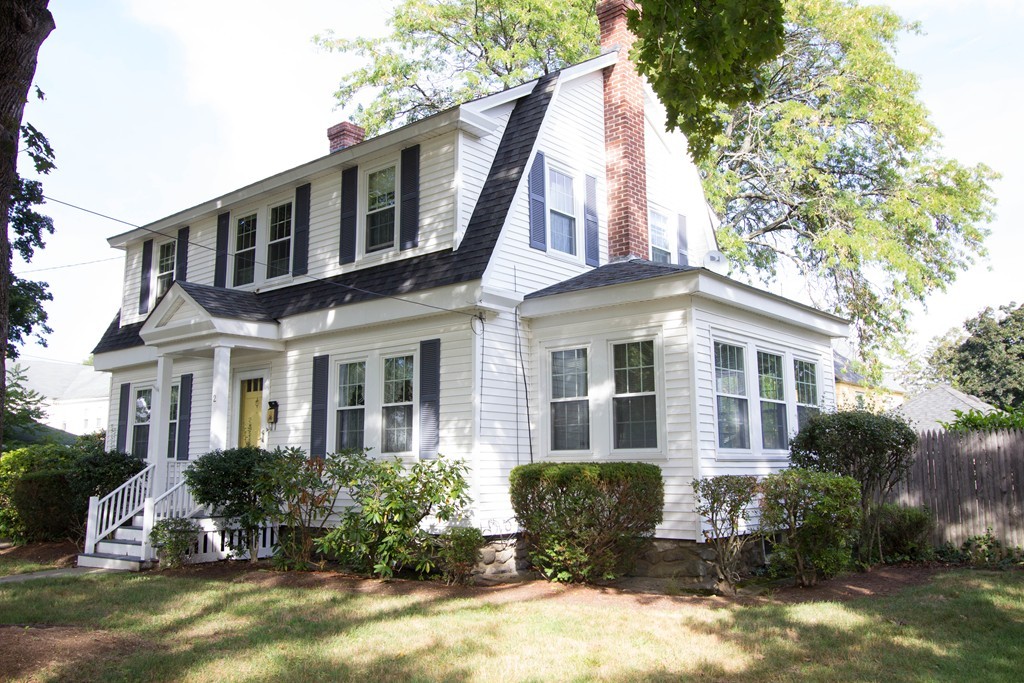 2 Summer Hill Road Maynard, MA 01754 - Photo 1 of 23 a front view of a house with yard and trees around