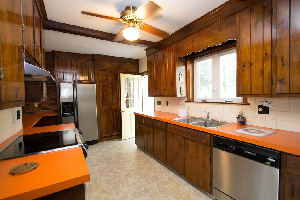 2 Summer Hill Road Maynard, MA 01754 - Photo 7 of 23 a kitchen with stainless steel appliances a sink stove and refrigerator