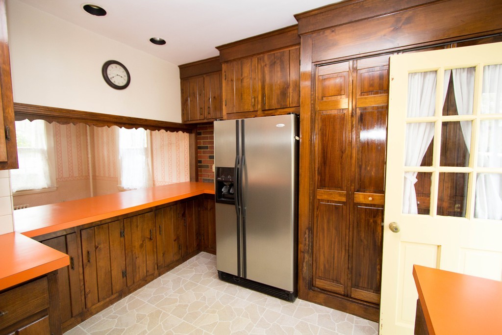 2 Summer Hill Road Maynard, MA 01754 - Photo 8 of 23 a kitchen with stainless steel appliances granite countertop a refrigerator and a wooden cabinets
