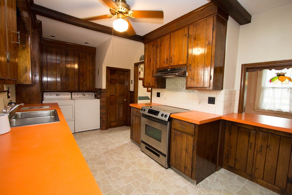 2 Summer Hill Road Maynard, MA 01754 - Photo 9 of 23 a kitchen with stainless steel appliances a sink cabinets and a window
