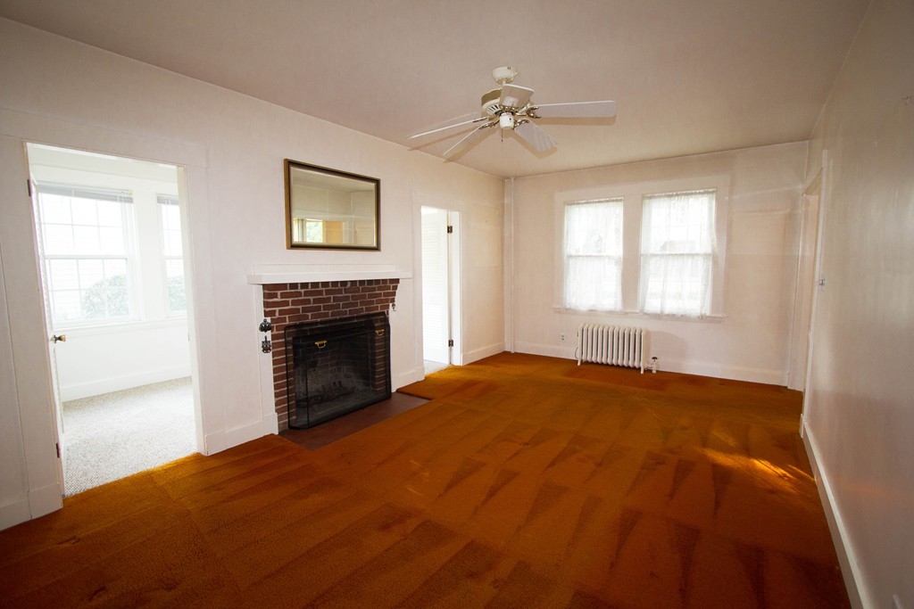 2 Summer Hill Road Maynard, MA 01754 - Photo 10 of 23 a view of an empty room with window and fireplace