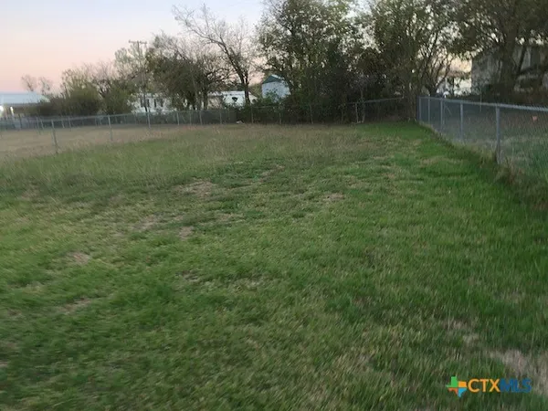 a view of outdoor space with deck and yard