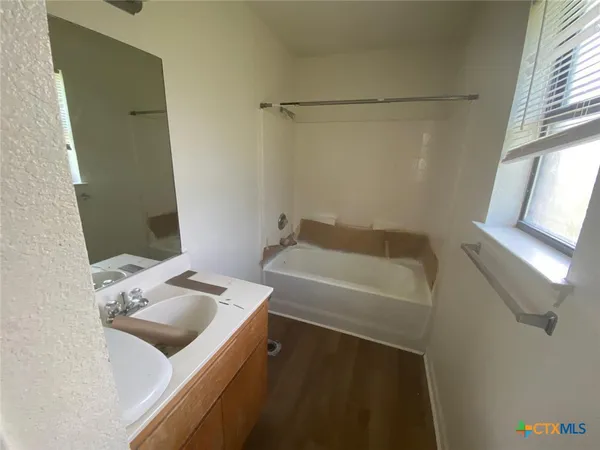 a bathroom with a sink and a bathtub