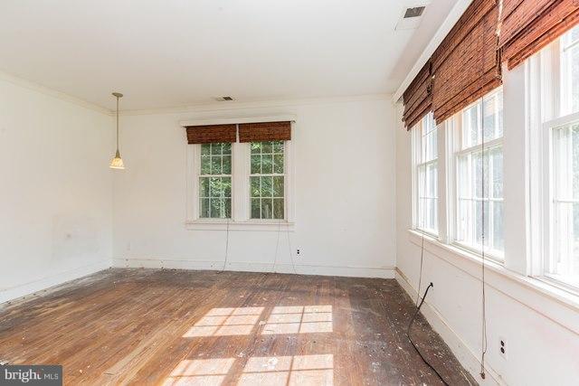 5865 Solomons Island Road Tracys Landing, MD 20779 - Photo 11 of 29 an empty room with windows