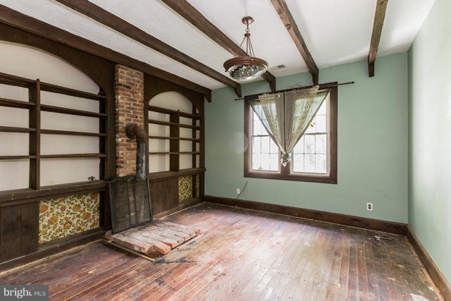 5865 Solomons Island Road Tracys Landing, MD 20779 - Photo 13 of 29 a view of an empty room with wooden floor and a window