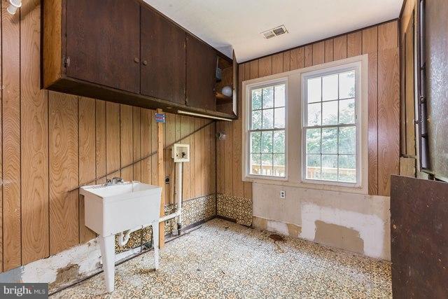 5865 Solomons Island Road Tracys Landing, MD 20779 - Photo 14 of 29 a view of an empty room with wooden floor and a window