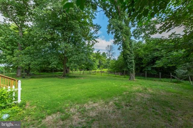 5865 Solomons Island Road Tracys Landing, MD 20779 - Photo 22 of 29 a view of a green yard