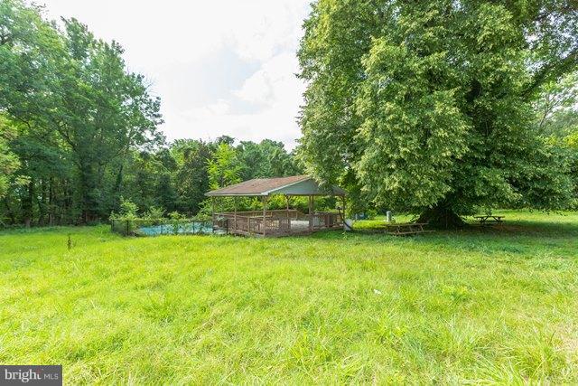 5865 Solomons Island Road Tracys Landing, MD 20779 - Photo 24 of 29 a house with a yard