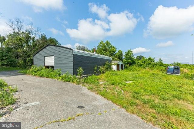 5865 Solomons Island Road Tracys Landing, MD 20779 - Photo 29 of 29 a view of a house with a garden