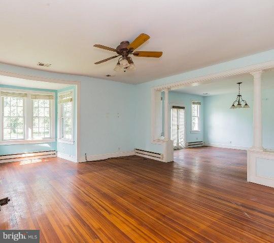 5865 Solomons Island Road Tracys Landing, MD 20779 - Photo 9 of 29 a view of empty room with wooden floor and fan