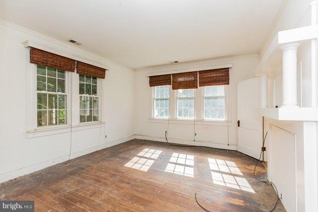 5865 Solomons Island Road Tracys Landing, MD 20779 - Photo 10 of 29 an empty room with windows