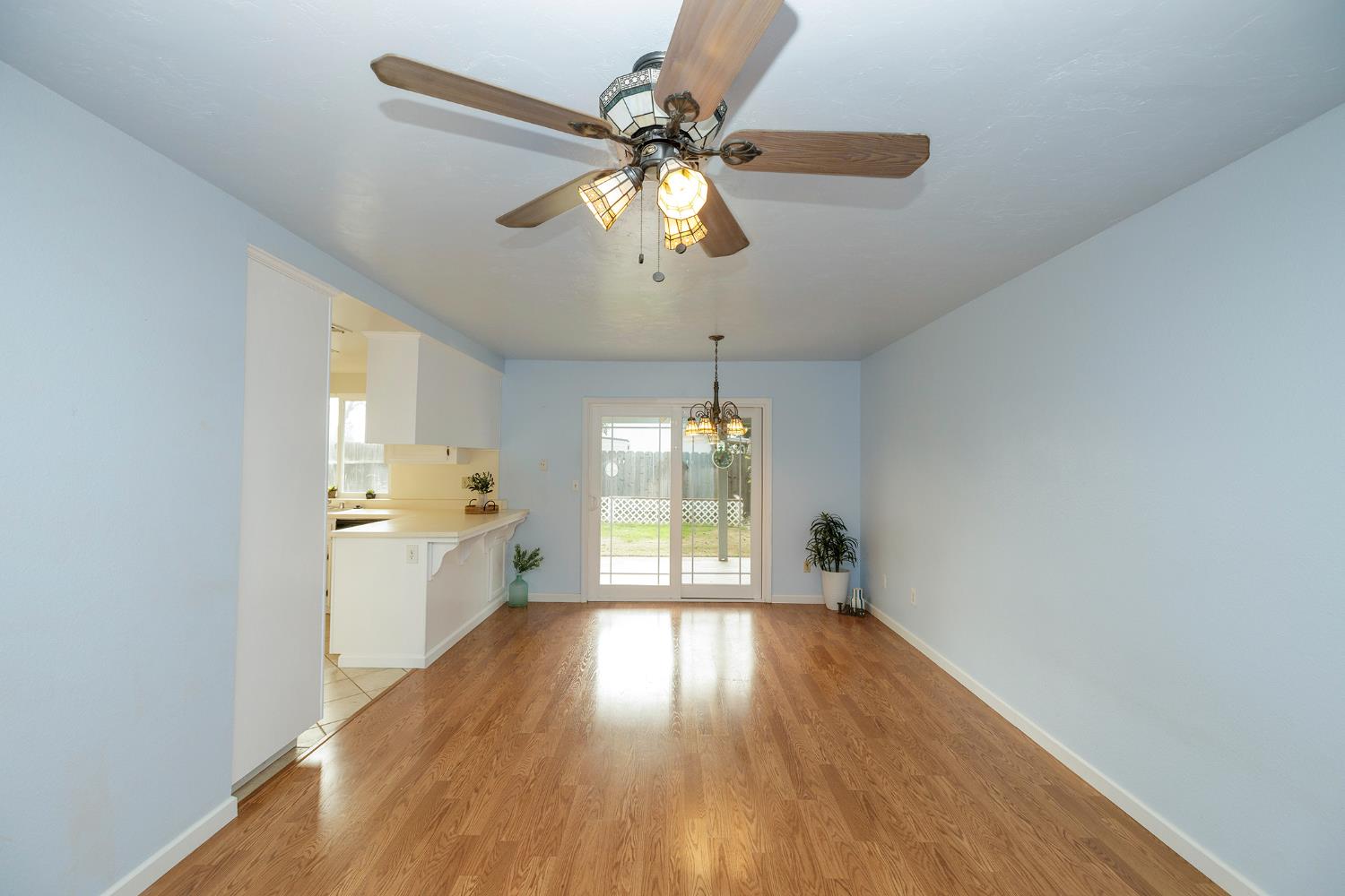 495 Valdapena Way Escalon, CA 95320 - Photo 20 of 43 a view of an empty room with window and wooden floor