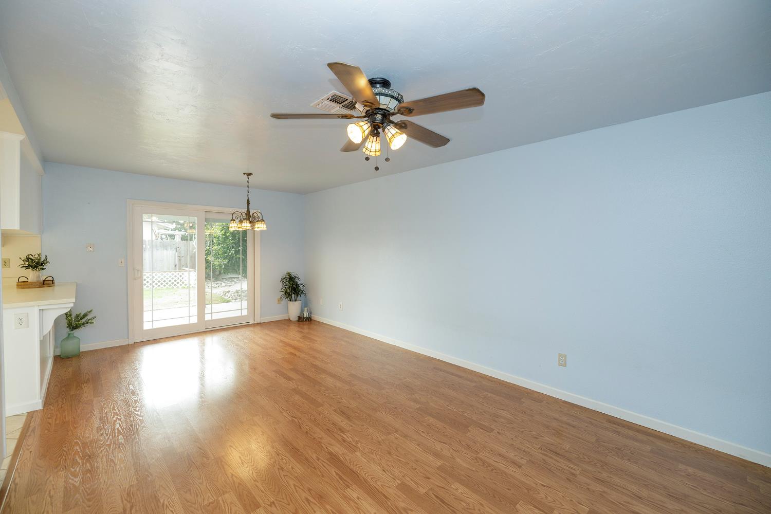 495 Valdapena Way Escalon, CA 95320 - Photo 21 of 43 wooden floor in an empty room with a window