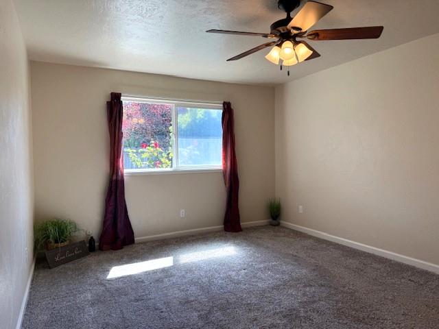 495 Valdapena Way Escalon, CA 95320 - Photo 22 of 38 an empty room with windows and fan