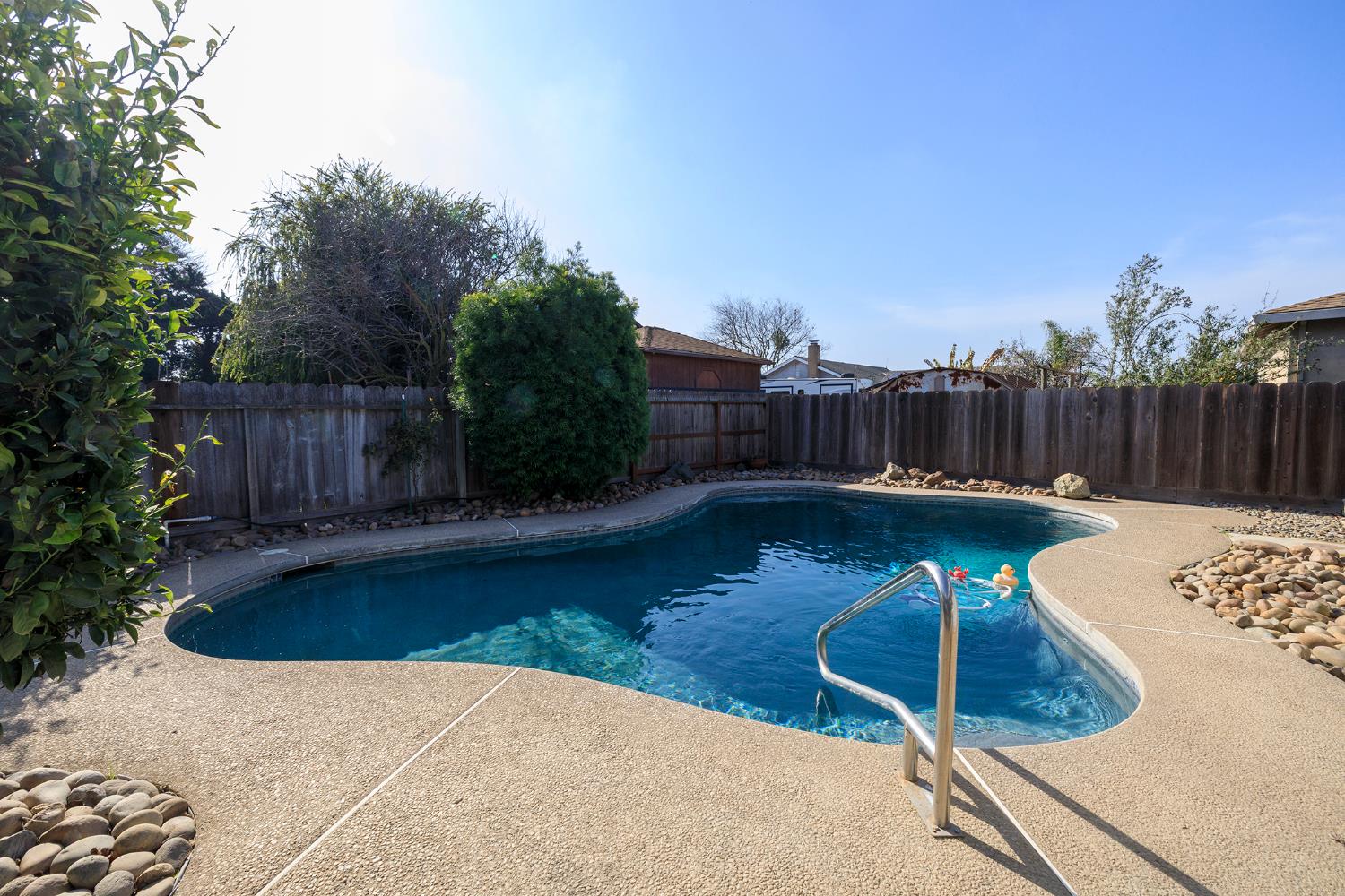 495 Valdapena Way Escalon, CA 95320 - Photo 37 of 43 a view of a backyard with sitting area