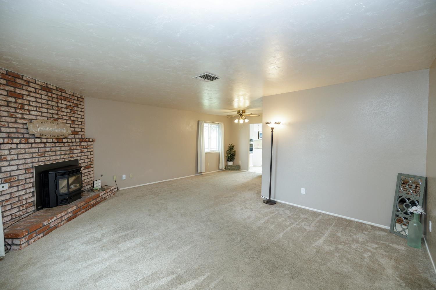 495 Valdapena Way Escalon, CA 95320 - Photo 6 of 43 a view of a livingroom with a fireplace