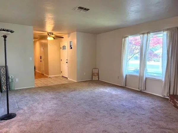 a view of an empty room with a window