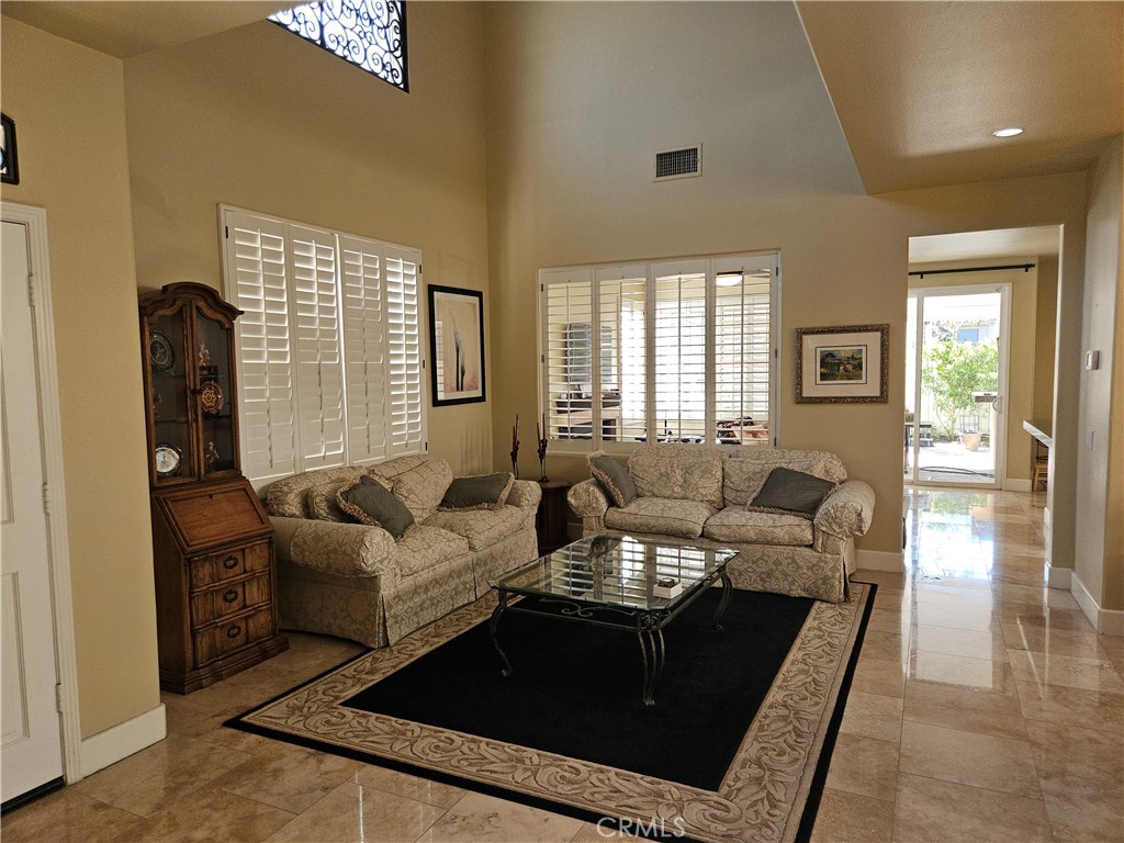12924 Maxwell Drive Tustin, CA 92782 - Photo 6 of 8 a living room with furniture and a large window