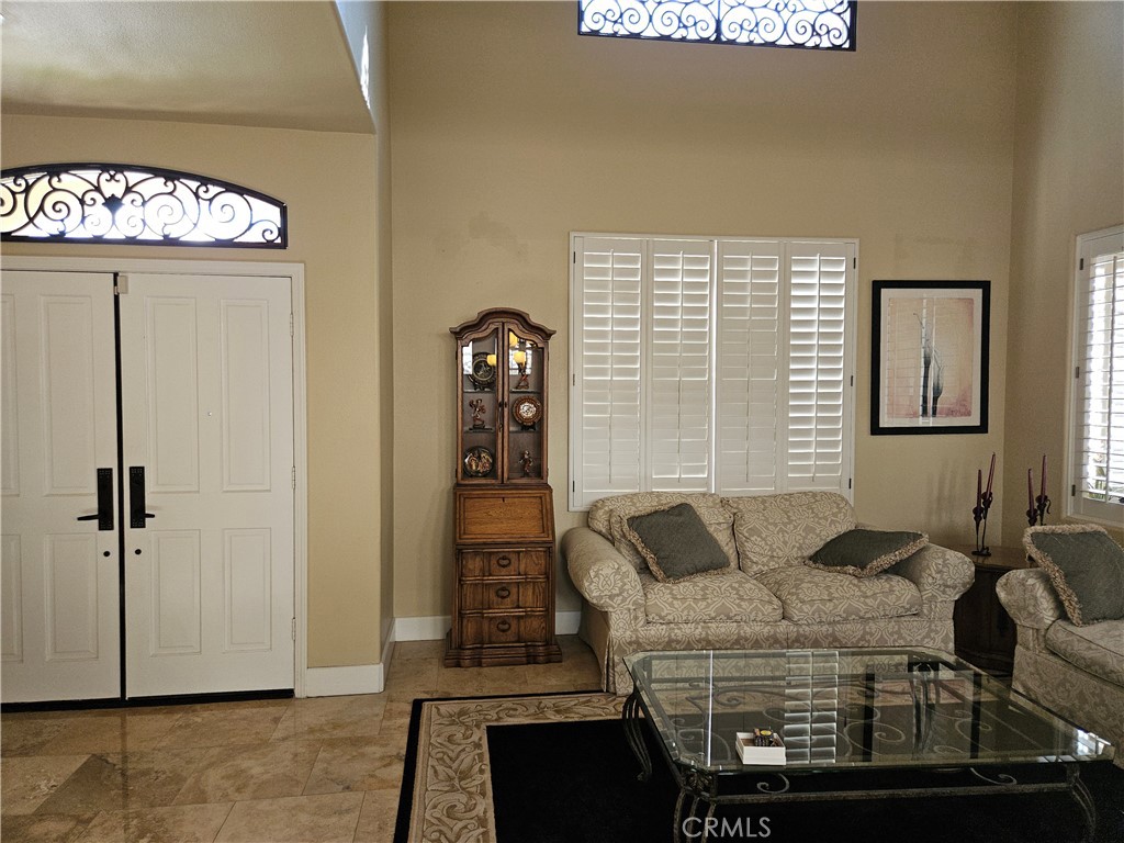 12924 Maxwell Drive Tustin, CA 92782 - Photo 7 of 8 a bedroom with a bed and a chandelier